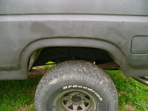 1989 Ford Bronco - Close-up of a truck's rear wheel well and tire, with visible BFGoodrich branding.