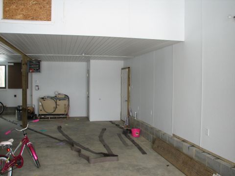 1992 Ford Bronco - Garage interior scene with a bicycle, generator, and construction materials visible.