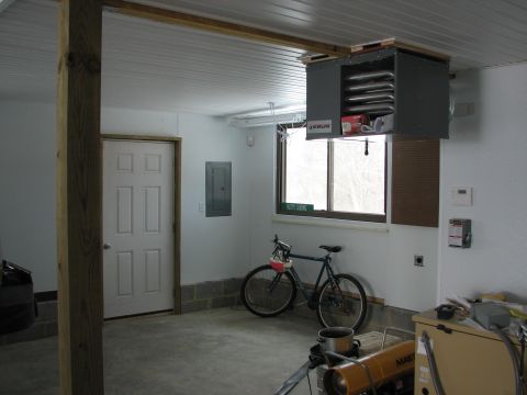 1992 Ford Bronco - Interior view of a garage, a bicycle, a door, and storage units.