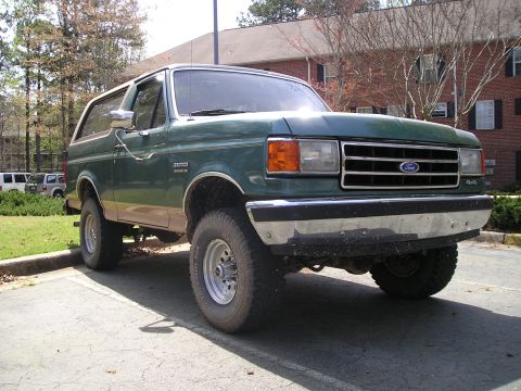 1989 Ford Bronco - This 1989 Ford Bronco is parked outside a building on a sunny day.