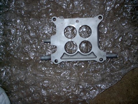 1982 Ford Bronco - A four-barrel carburetor spacer is shown, likely for an engine upgrade or repair.
