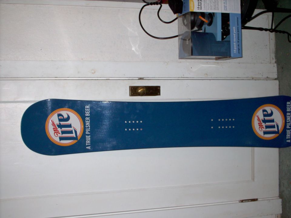 Blue snowboard with Miller Lite logos and text 'A TRUE PILSNER BEER.'