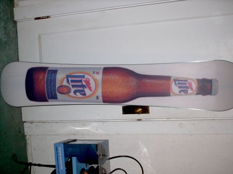 1982 Ford Bronco - This snowboard features a large graphic of a Miller Lite beer bottle.