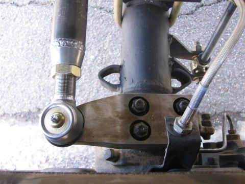 1987 Suzuki Samurai - A close-up view of a vehicle's high steer arm assembly, showing mechanical components and fasteners.