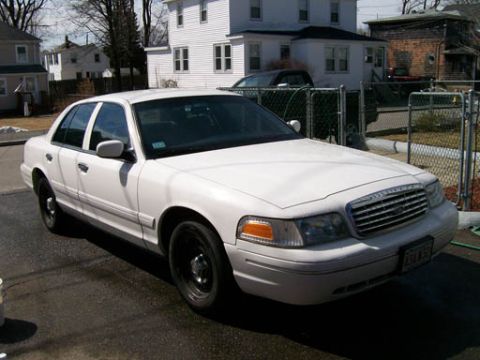 1999 Ford Crown Victoria - This 1999 Ford Crown Victoria is shown from a 3/4 front angle, highlighting its grille and overall body style.