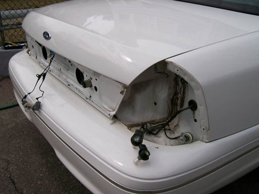 White 1999 Ford Crown Victoria rear with taillights removed