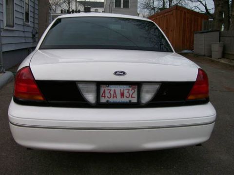 1999 Ford Crown Victoria - Rear view of a 1999 Ford Crown Victoria showing the taillights and license plate.