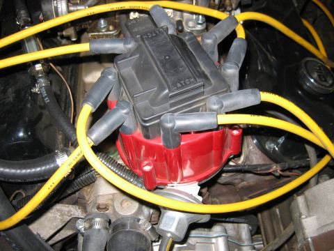 1985 Ford LTD Crown Victoria - Close-up view of an engine's distributor cap and spark plug wires.