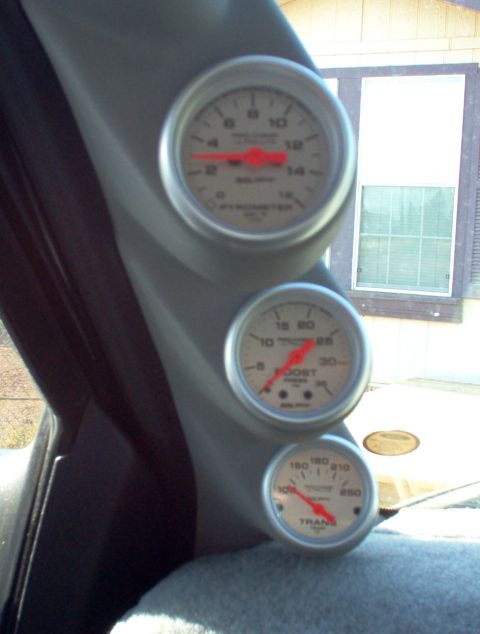 1995 Ford Bronco - A trio of aftermarket gauges are installed in the vehicle's interior.