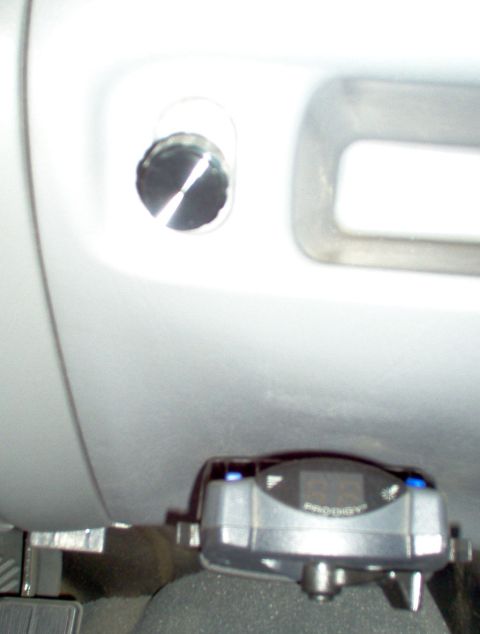1995 Ford Bronco - Close-up of a trailer brake controller with a digital display and blue indicator lights.
