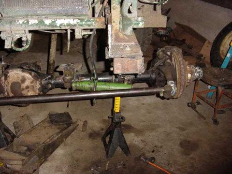 1992 Ford Bronco - Close-up view of vehicle axle and suspension components, likely undergoing repair or modification.