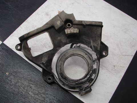 1992 Ford Taurus - A gray metal crank pulley cover is shown from a top-down perspective on a checkered surface.