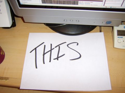 1989 Ford Bronco - A piece of paper with the word 'THIS' written on it is placed on a desk.