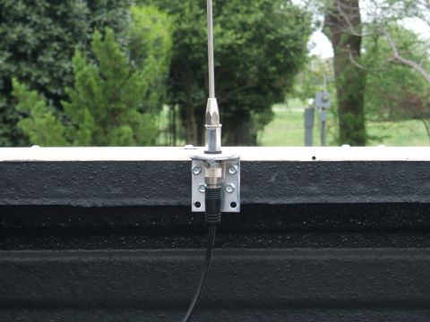 1991 Ford Bronco - Close-up of an antenna mount attached to a vehicle's exterior.