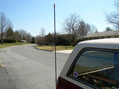 1992 Ford Bronco - A rear view of a Ford Bronco shows its distinctive body style and an antenna mounted on the side.