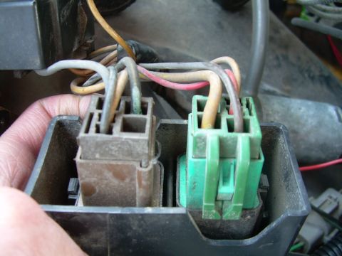 1988 Ford Bronco - Close-up view of two electrical connectors and their associated wiring, likely part of a vehicle's electrical system.
