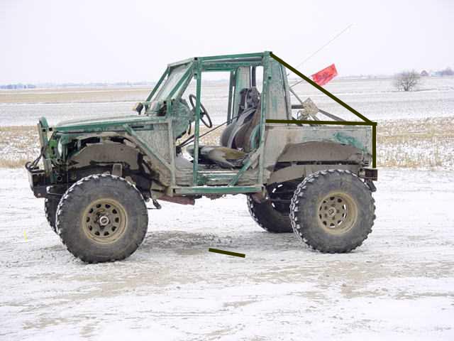 Off-road vehicle with roll cage, large tires, and no doors, parked in a snowy field