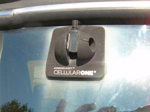 1992 Ford Bronco - This image shows a Comcast Cellular One antenna mount attached to the interior of a vehicle's window.
