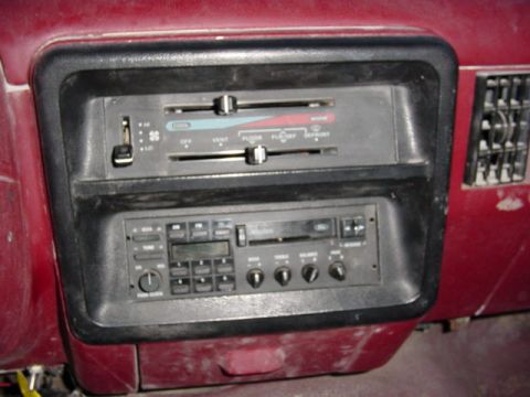 1992 Ford Bronco - Interior view of a 1992 Ford Bronco, highlighting the dashboard's radio and climate control panel.