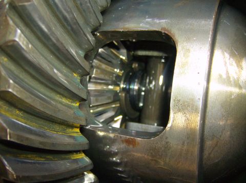 1986 Ford Bronco - Differential gears showing wear and lubricant residue. The registry information for this part is not verifiable from the image.