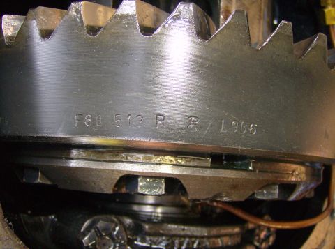 1986 Ford Bronco - Close-up of a differential gear with stamped part numbers and a date code.