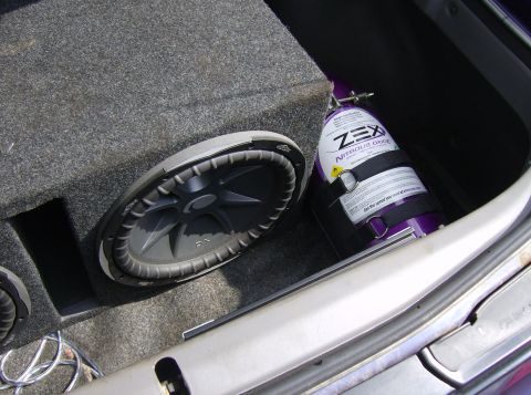 1996 Ford Probe - Custom trunk setup a Kicker subwoofer and a ZEX nitrous oxide tank.