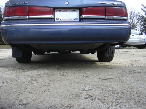 1996 Ford Crown Victoria - Rear view of a 1996 Ford Crown Victoria showing the bumper, exhaust, and suspension components.