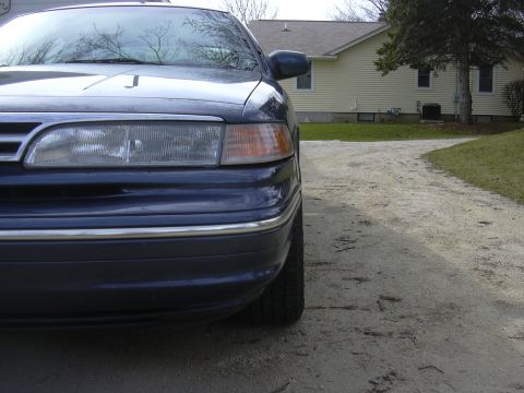 1996 Ford Crown Victoria - Front quarter view of a dark blue 1995 Ford Crown Victoria parked on a gravel driveway.