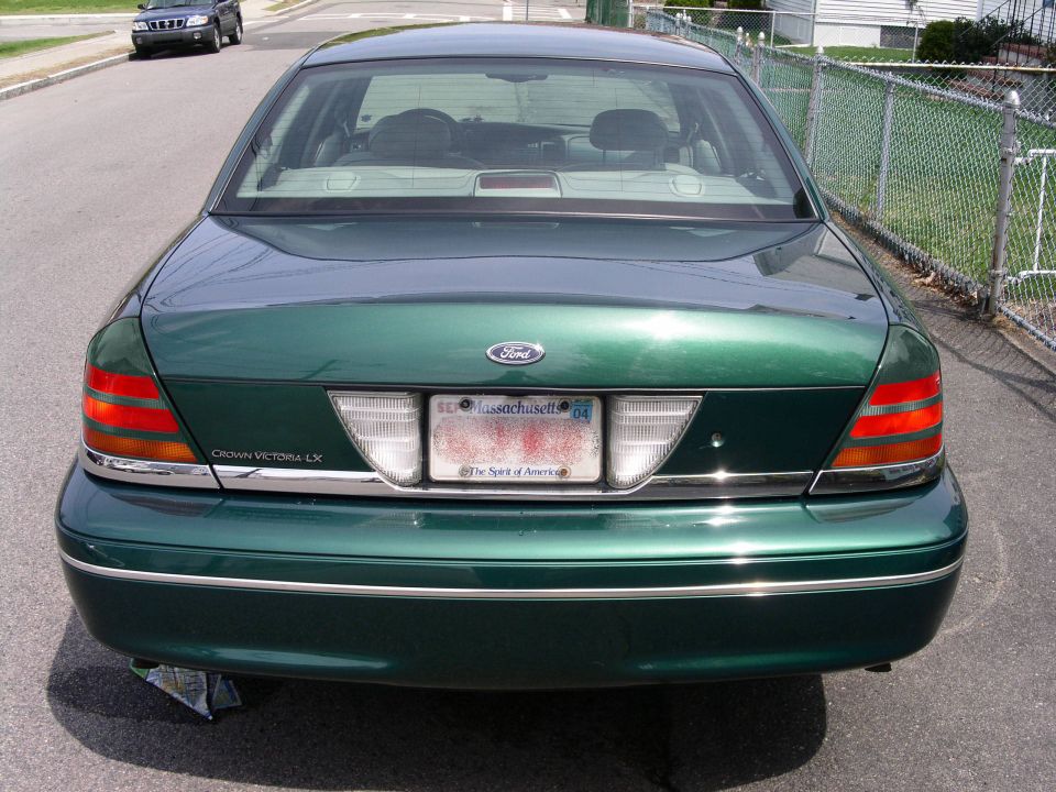 Green 2001 Ford Crown Victoria LX rear view with Massachusetts plates
