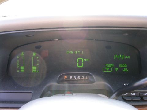2001 Ford Crown Victoria - The digital dashboard displays speed, fuel level, engine temperature, and trip data.