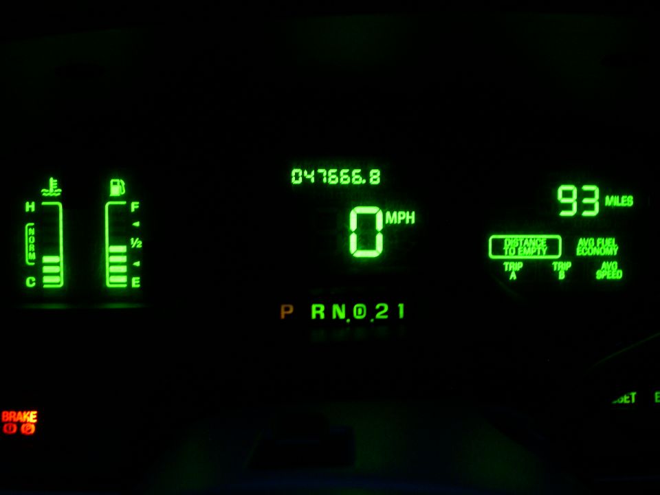 2001 Ford Crown Victoria digital dashboard with 0 MPH, 47666.8 miles, and fuel/temp gauges