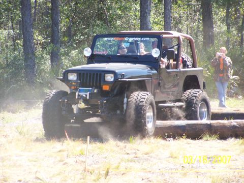 1989 Ford Bronco - This Jeep Wrangler is navigating an off-road obstacle course.