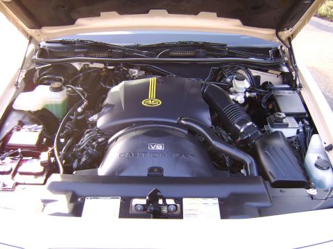 1996 Mercury Grand Marquis - Close-up view of a V8 engine bay, showing the engine cover and air intake system.