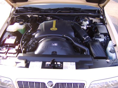 1996 Mercury Grand Marquis - Engine bay view of a 1996 Mercury Grand Marquis, showing the V8 4.6 liter engine cover.