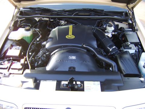 1996 Mercury Grand Marquis - Engine bay of a 1996 Mercury Grand Marquis, showing the V8 4.6L engine cover.
