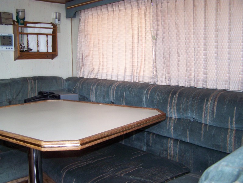 Interior camper van seating and table with digital clock