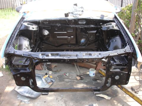 1992 Ford Taurus - The engine compartment of a 1992 Ford Taurus is shown after being painted black.