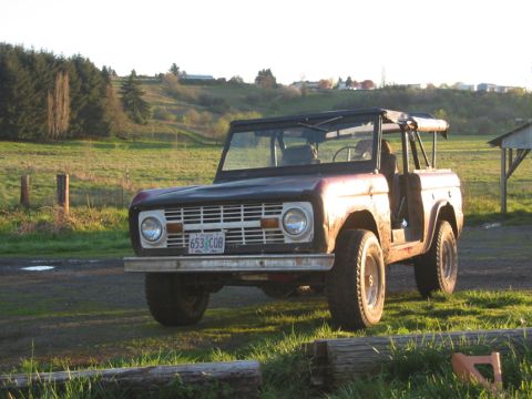 1968 Ford Bronco - This 1968 Ford Bronco is seen outdoors during the golden hour, with a rural landscape behind it.