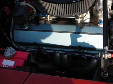 1998 Ford Crown Victoria - Close-up of a V8 engine showing a teal valve cover, chrome air cleaner and black MSD Ultra 40 spark plug wires over the headers.
