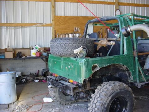 1992 Ford Bronco - tire carrier. frame mounted and a gas tnak protector