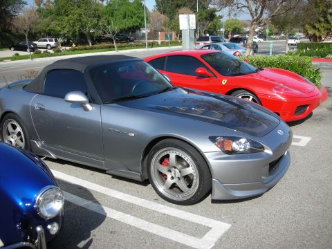 1998 Ford Crown Victoria - silver Honda S2000 convertible with its hardtop on is parked next to a red Ferrari and a blue car at a car meet.