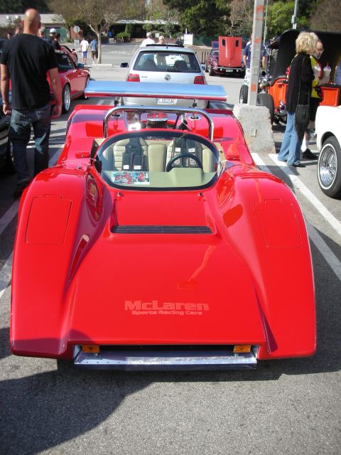 1998 Ford Crown Victoria - Rear view of a red open-cockpit McLaren sports racing car with McLaren Sports Racing Cars lettering on the bodywork.