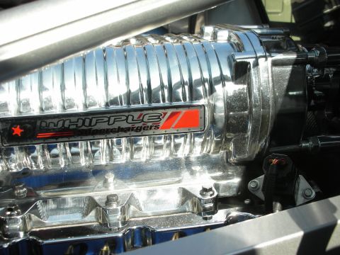 1998 Ford Crown Victoria - Close-up of a chrome Whipple Superchargers blower showing its branded badge on the side of an engine.