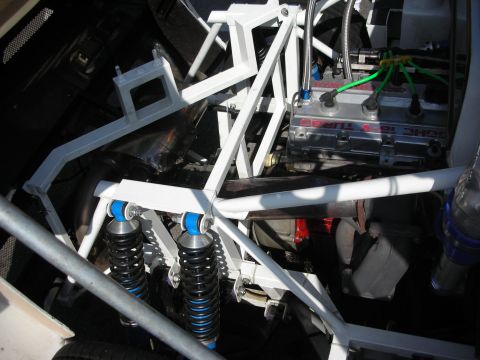 1998 Ford Crown Victoria - fabricated aluminum intake plenum and heat exchanger mounted in a white tube-frame race car engine bay.