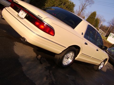 1996 Mercury Grand Marquis - Rear view of a 1996 Mercury Grand Marquis sedan with custom wire wheels.