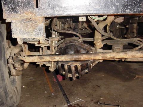 1992 Ford Bronco - Undercarriage view of a vehicle's rear differential and suspension system.