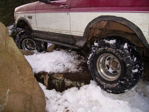 2000 Chevrolet Tahoe - This Ford Bronco is equipped for off-road conditions with large tires, seen here on a snowy trail.