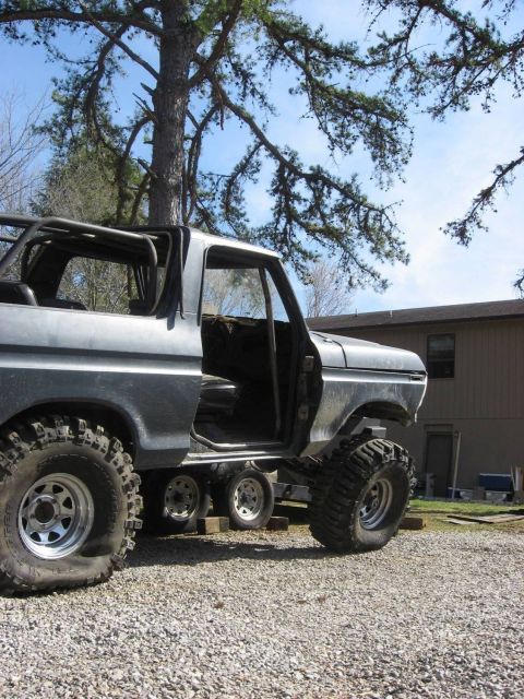 1979 Ford Bronco - This modified 1979 Ford Bronco features a prominent roll cage and oversized off-road tires.