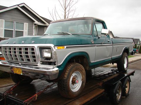 1996 Ford Bronco - This Ford pickup truck, likely from the late 1970s, is being transported on a trailer.