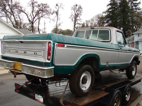 1996 Ford Bronco - This Ford pickup truck, likely a 1979 model, is being transported on a trailer.